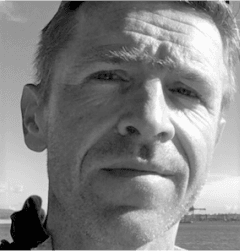 Portrait of Karsten smiling in a professional headshot